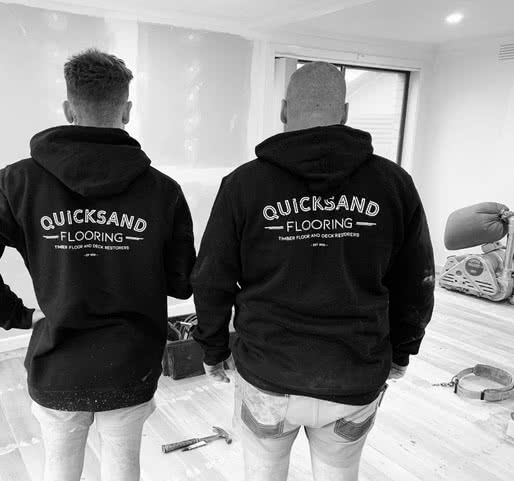 Quicksand flooring staff in logo hoodies