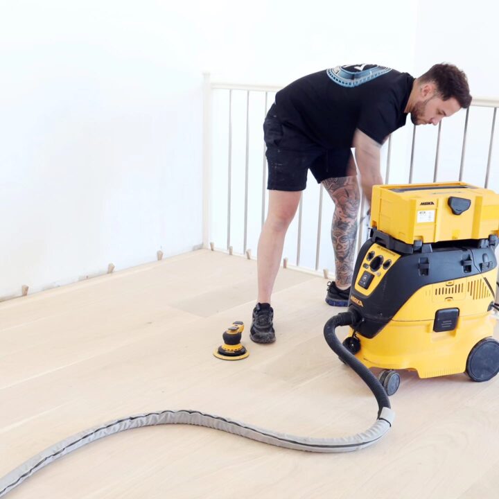 JP Timber Floors staff using a floor sanding machine