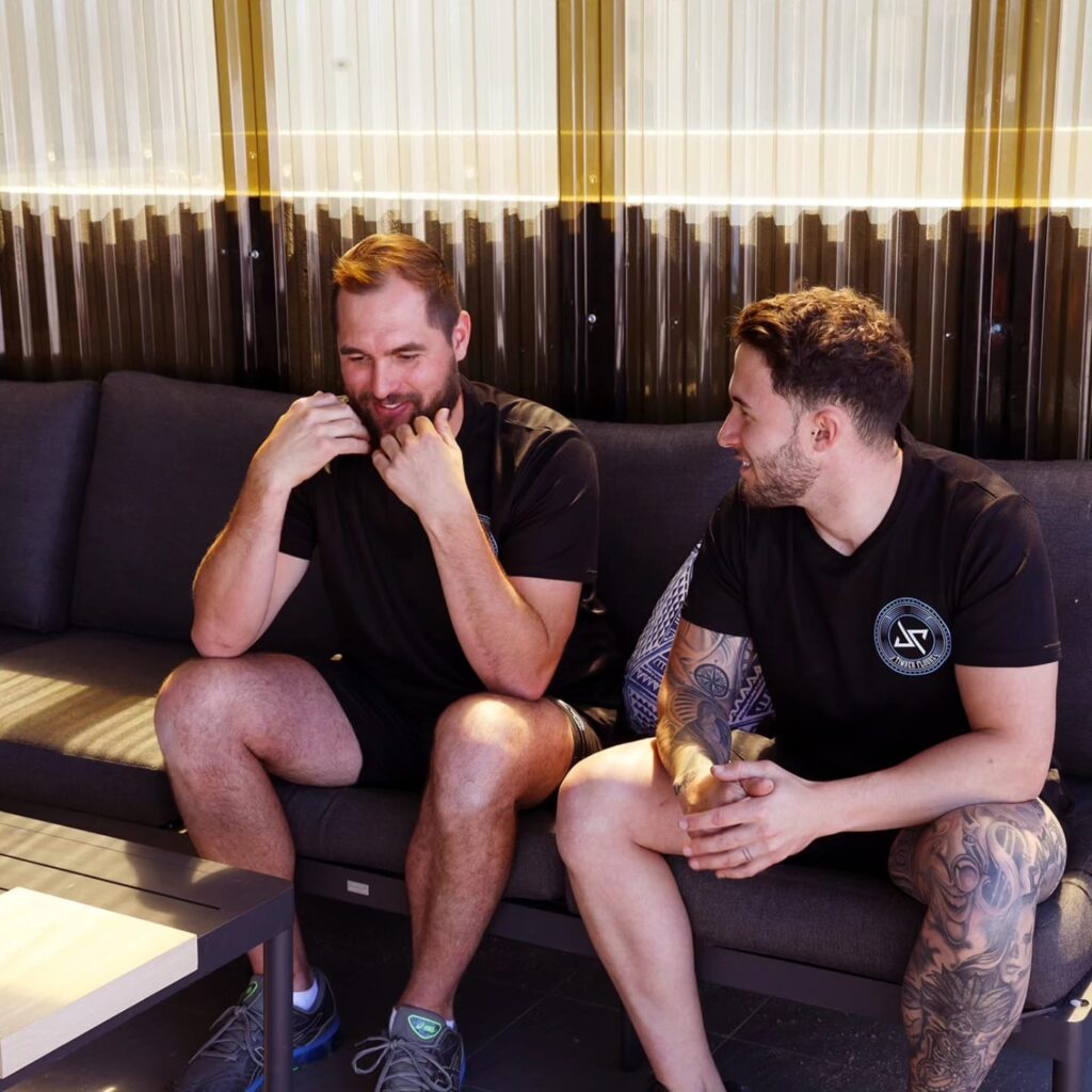 The boys from JP Timber Flooring sitting on a couch together