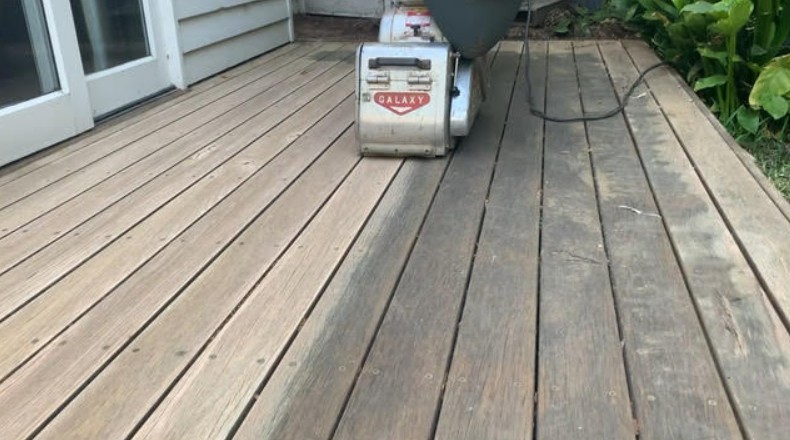 Deck sanding job with sanding machine